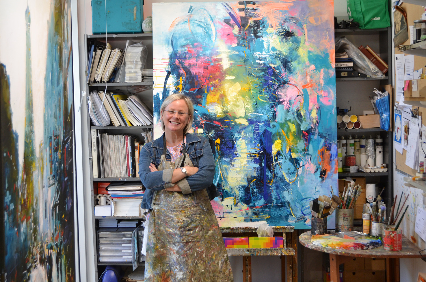 Judith Dalozzo in her Art Studio Beside Abstract Painting